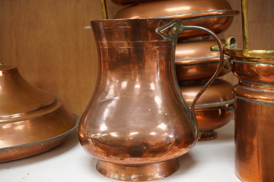 Copper vessels and a brass handled jug and bucket, largest 33cm high